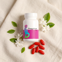 PregyMom prenatal supplement bottle with red caplets on soft linen